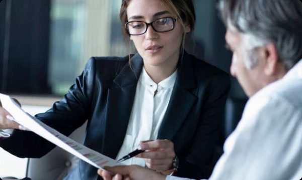 Attorney reviewing case documents with a client