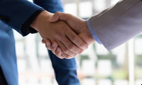 Handshake sealing a successful disability claim settlement